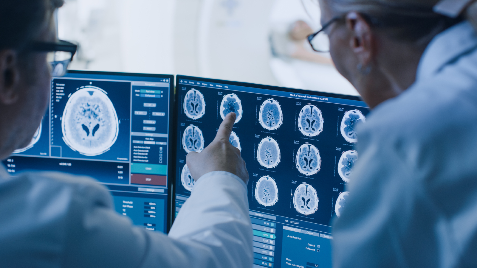 doctors looking at brain scans on computer